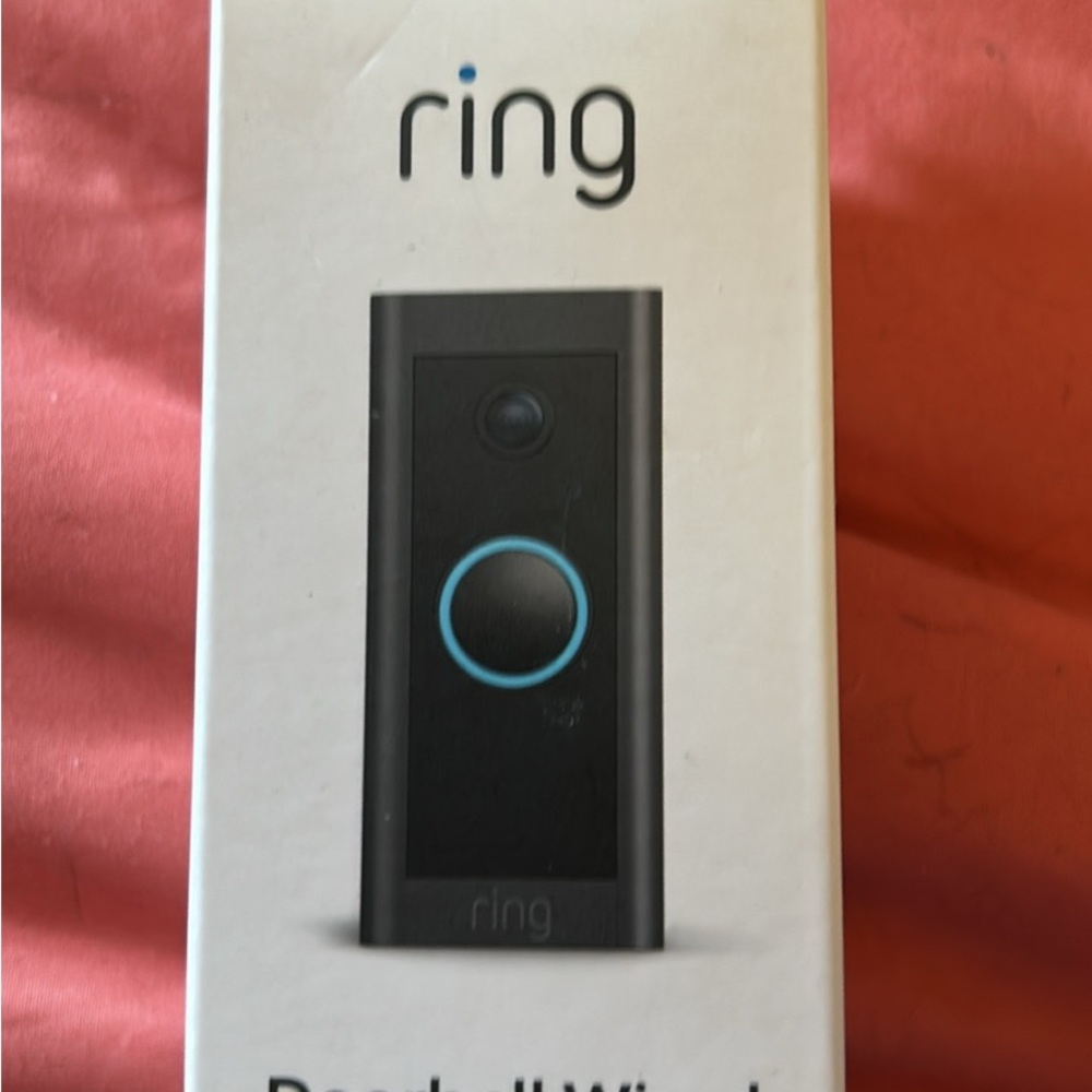 Ring Doorbell Wired in Black and Blue. Brand new.I never used. In original box.